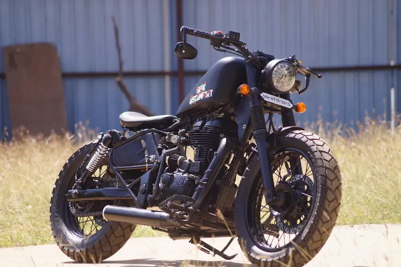 Royal Enfield bobber customized by EBS Customs Bombay parked outdoors