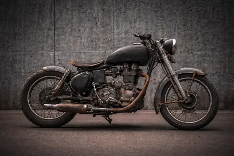 “1986 Royal Enfield Bullet 350 custom bobber front and rear view, raw metal finish by Bombay Custom Works Mumbai”