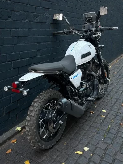 Mud-covered Yezdi Adventure Rally Pro showing custom wrap by Bombay Custom Works