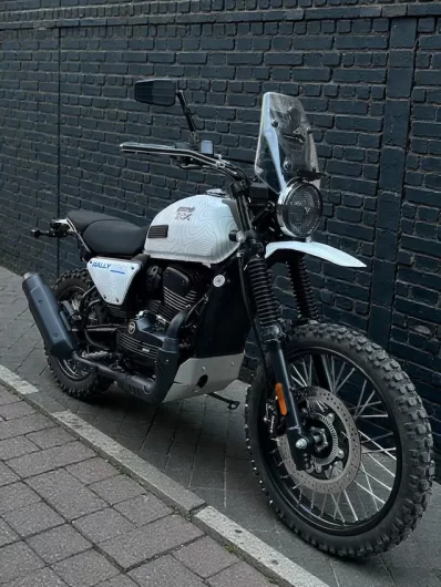 Yezdi Adventure custom wrapped motorcycle in muddy trail adventure scene