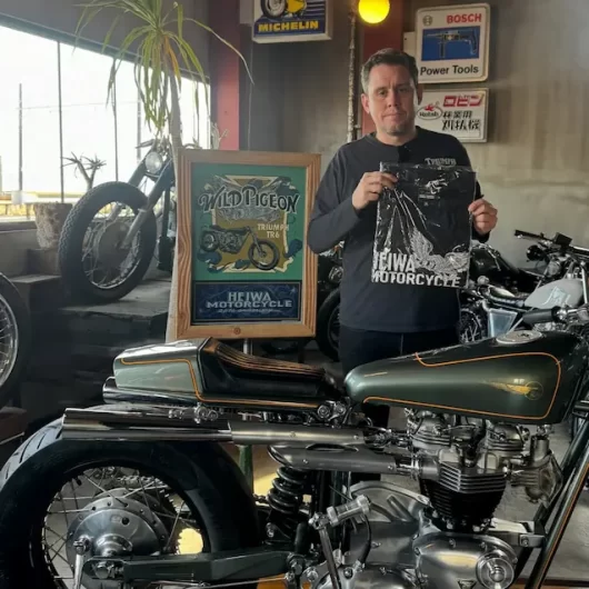 Heiwa Motorcycle builder with custom Triumph TR6 cafe racer inside Heiwa Motorcycle workshop Hiroshima Japan