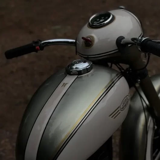 Vintage Jawa 250 custom paint tank and badge restoration close up