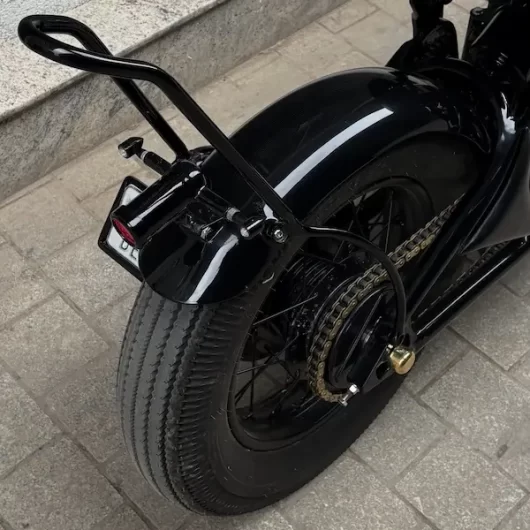 Rear wheel and hardtail frame detail of Royal Enfield Bullet 500 custom chopper