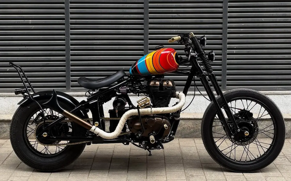 Royal Enfield Bullet 500 chopper by VP Designs Custom Paintshop in full side profile with retro rainbow fuel tank
