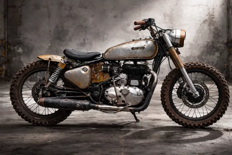 Royal Enfield UCE Bullet 500 by Bombay Custom Works with rugged scrambler styling in grey warehouse background