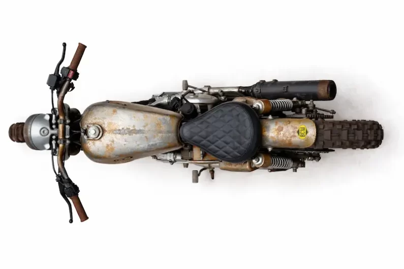 Top view of Royal Enfield UCE Bullet 500 by Bombay Custom Works showing patina fuel tank and diamond stitched solo seat